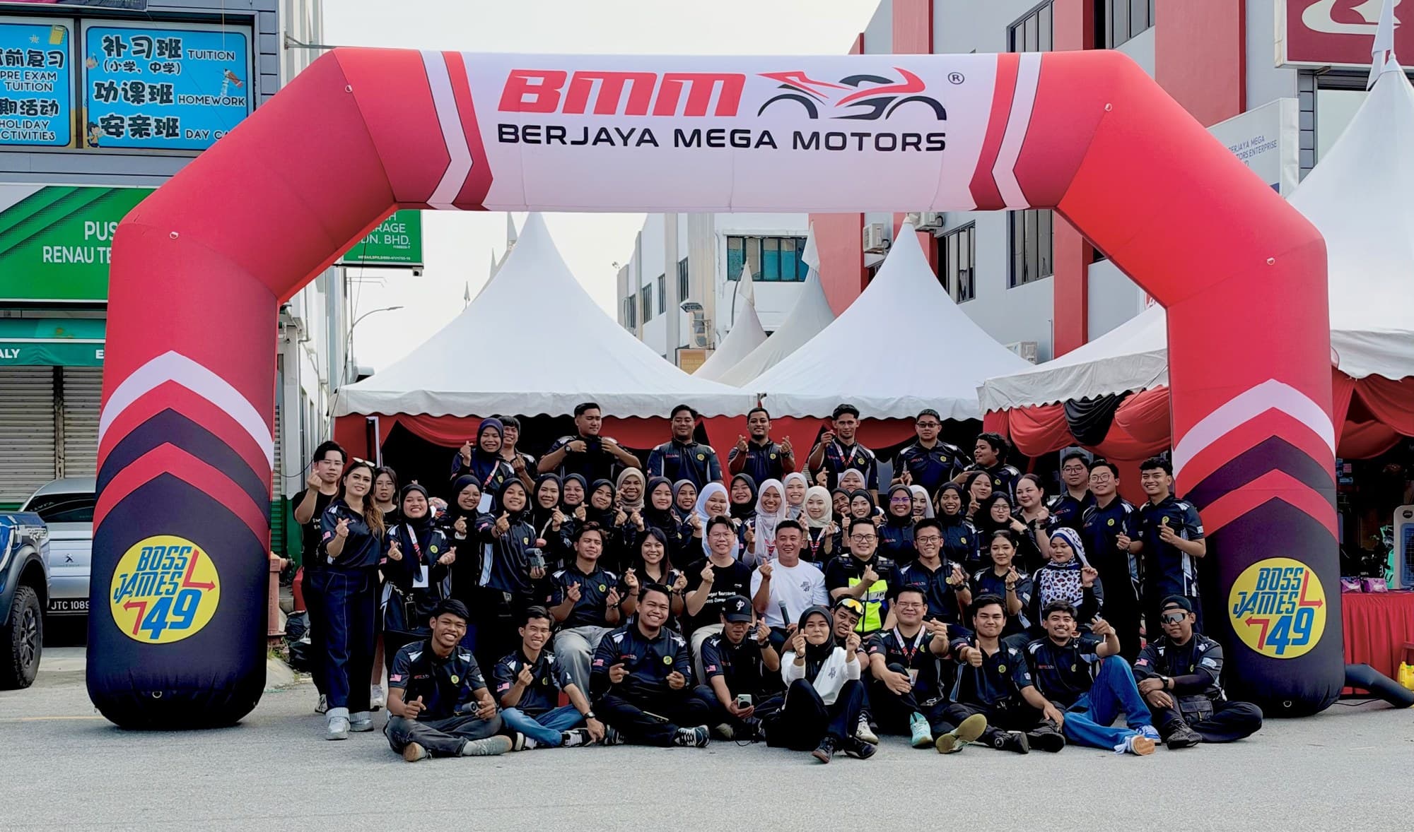 The Berjaya Mega Motors team under the BMM arch